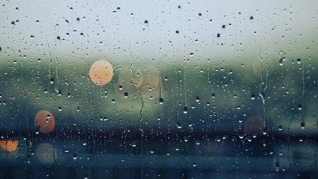 Glistening Raindrops on Glass Window wallpaper