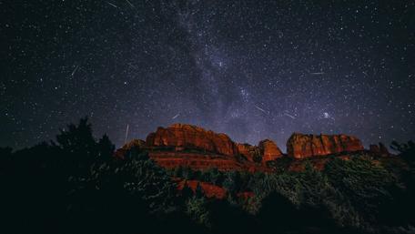 Starry Haven Over Majestic Peaks wallpaper