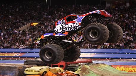 Thrilling Monster Truck Jumping Action wallpaper