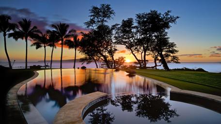 Tropical Sunset Reflections at a Luxury Resort wallpaper