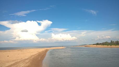 Serene River Meets Sky in Tranquil Landscape wallpaper