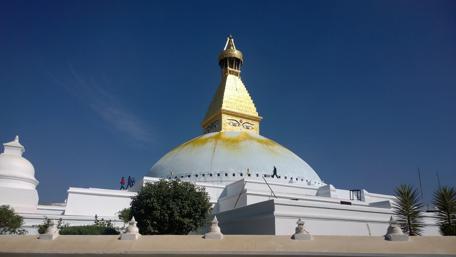 Golden Stupa Beneath a Clear Blue Sky wallpaper