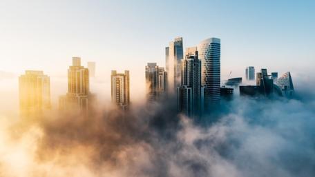 Majestic Cityscape Above the Clouds wallpaper