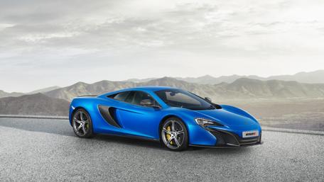 Dreamy Blue Supercar on Mountain Road wallpaper