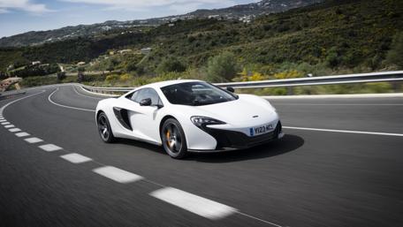 Dream Car Racing Through Scenic Roads wallpaper