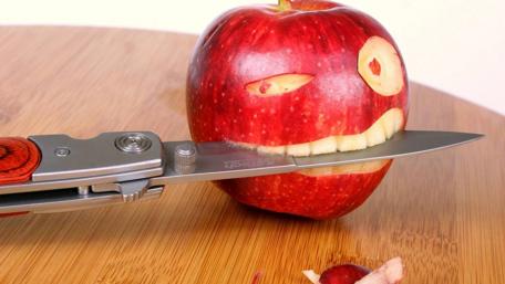 Apple with a Bite and a Knife wallpaper