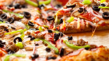 Deliciously Cheesy Pizza Feast wallpaper