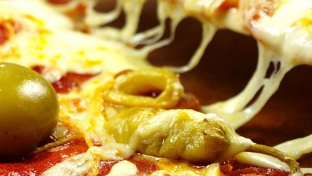 Cheesy Delight with Olives and Peppers wallpaper