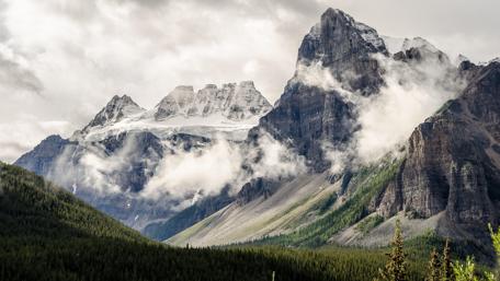 Majestic Mountains Shrouded in Clouds wallpaper
