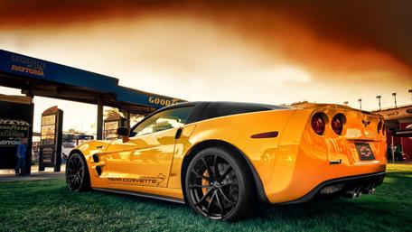 Iconic Yellow Corvette in a Stunning Setting wallpaper