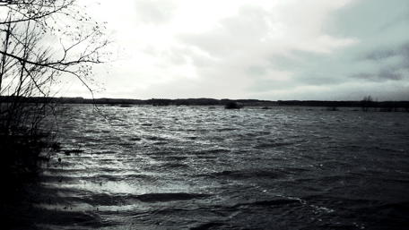 Serene Waters Under a Stormy Sky wallpaper