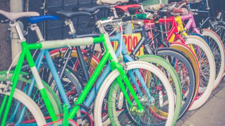 Colorful Bicycle Parking in Urban Scene wallpaper