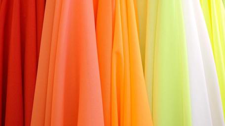 Vibrant Hues of Fabric Flowing Together wallpaper