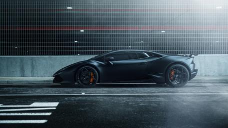 Sleek Black Lamborghini Huracan in Urban Setting wallpaper