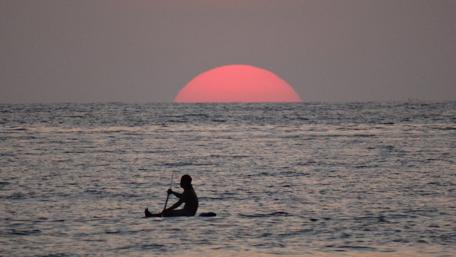 Serene Sunset Over Bali's Tranquil Waters wallpaper