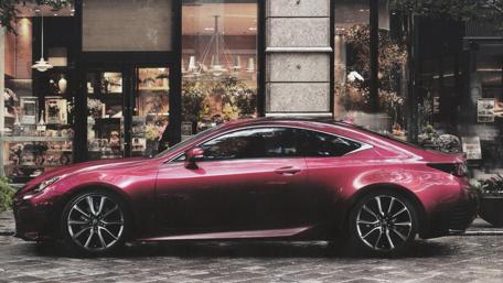Sleek Lexus Coupe in Urban Setting wallpaper