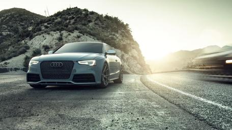 Sleek Audi RS5 on a Scenic Mountain Road wallpaper