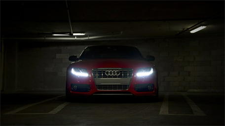 Audi RS5 in Dimly Lit Parking Garage Scene wallpaper
