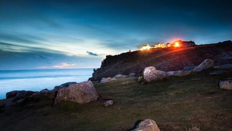 Tranquil Evening by the Coast with Stones wallpaper