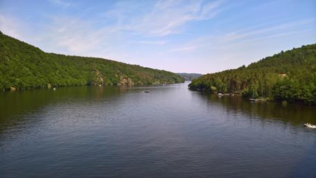 Serene River Reflections in Nature's Embrace wallpaper