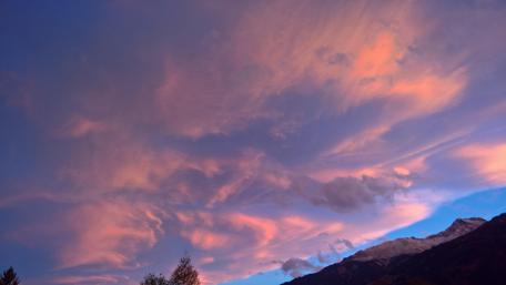 Serene Morning Sky with Vibrant Clouds and Sunlight wallpaper