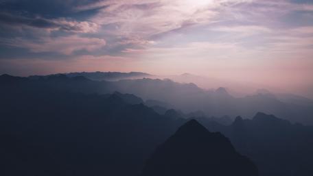 Mountain Silhouettes Under Pink Sky wallpaper