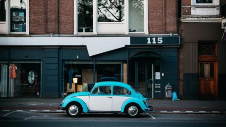 Vintage Beetle on a City Street wallpaper