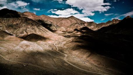 Majestic Desert Mountains Under a Dramatic Sky wallpaper
