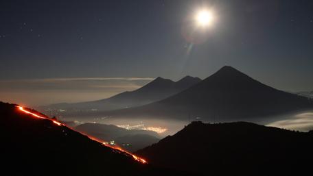 Luminous Night Over Fiery Mountains wallpaper