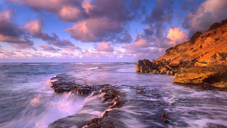 Stormy Shores and Serene Skies wallpaper