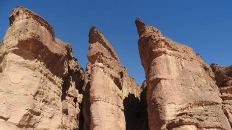 Majestic Rocky Cliffs Against Azure Sky wallpaper