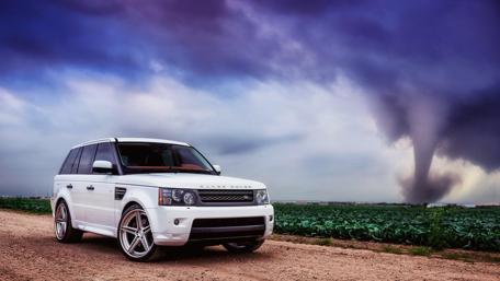 Spirit of Adventure: Range Rover in Nature's Fury wallpaper