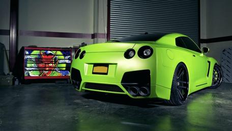 Vibrant Green Sports Car in Stylish Garage wallpaper