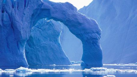 Majestic Ice Arch in Serene Blue Waters wallpaper