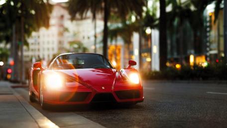 Red Ferrari Enzo on City Street wallpaper