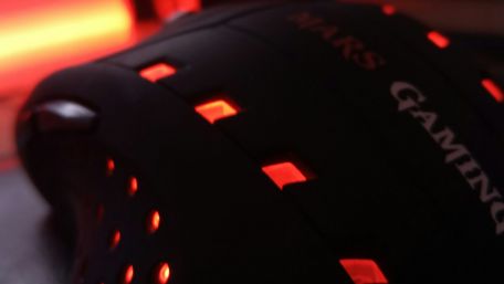 Futuristic Gaming Mouse in Red Glow wallpaper