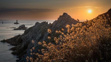 Golden Sunset Over Pointe du Raz Coastline in France wallpaper