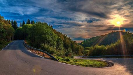 Peaceful Road Through Nature's Beauty wallpaper