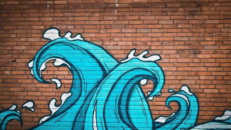 Ocean Waves Graffiti on Brick Wall wallpaper