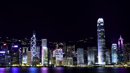 Vibrant Nightscape of Hong Kong's Victoria Harbour wallpaper