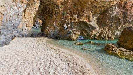 Serene Rocky Seashore of Mylopotamos Beach wallpaper
