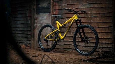 Mountain Bike Elegance Against Rustic Backdrop wallpaper