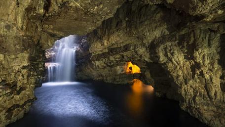 Majestic Beauty of Smoo Cave Waterfall wallpaper
