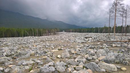 Stunning Rocky Landscape Under Dramatic Skies wallpaper