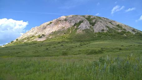 Serene Hill Under a Vast Blue Sky wallpaper