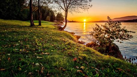 Dramatic sunset in foreground with Burnaby Lake wallpaper