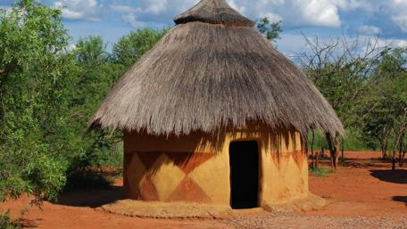 Rustic Charm of a Thatched Cottage wallpaper