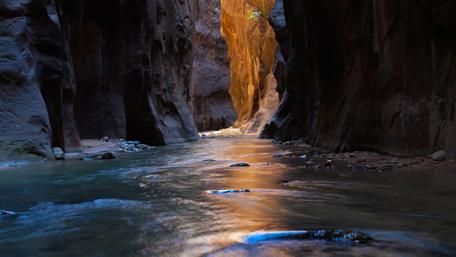 Mystical River Carving Through Ancient Canyon Walls wallpaper