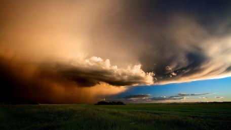 Storm above the field wallpaper