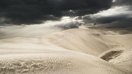 Beautiful cloudy sky above the desert wallpaper